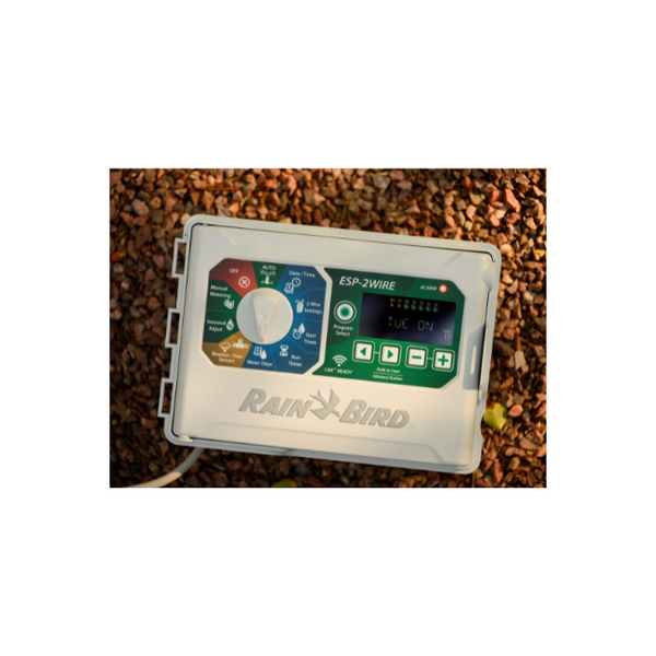 Rain Bird ESP-2WIRE irrigation controller, designed for efficient and reliable control of large-scale irrigation systems using 2-wire technology. This system allows for precise watering with simplified wiring and reduced installation costs. Image showcases the controller's user-friendly interface, advanced programming options, and compatibility with various Rain Bird components, offering an optimal solution for commercial and residential irrigation projects