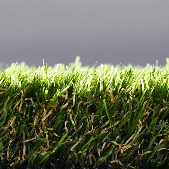 Artificial Grass Rosemary, crafted to provide a realistic, lush green look with a soft texture. Ideal for landscaping, gardens, balconies, and other outdoor spaces, this synthetic turf mimics the appearance of natural grass while requiring minimal maintenance. Image highlights its vibrant color, durable construction, and natural-looking blade pattern, offering a long-lasting and low-maintenance solution for any environment