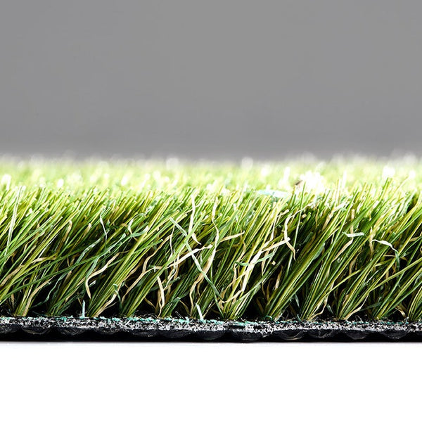 Artificial Grass Vinca, designed to replicate the look and feel of real grass with low-maintenance benefits. Ideal for landscaping, rooftops, terraces, and indoor spaces, this synthetic turf offers a realistic, lush green appearance. Image shows soft, durable fibers arranged to mimic natural grass blades, providing an eco-friendly, long-lasting alternative for decorative and functional spaces